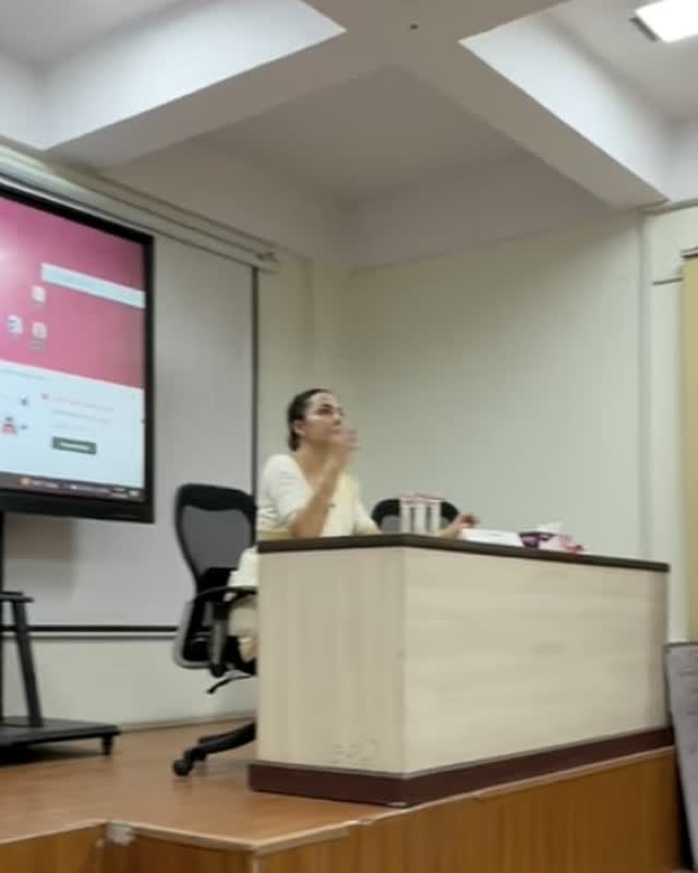 Neeru teaching a face yoga session at a seminar