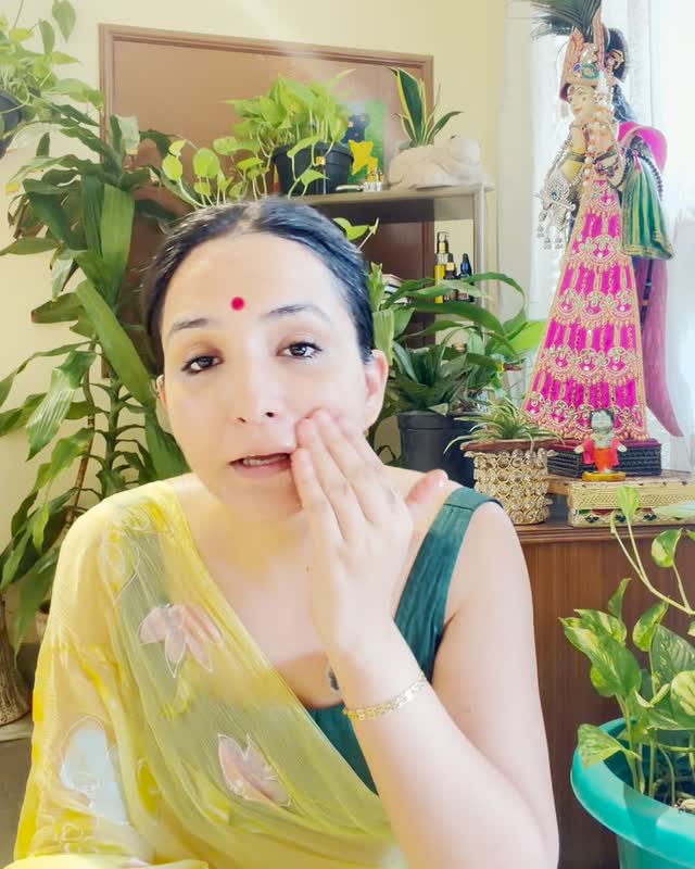 Neeru demonstrating a face yoga cheek massage