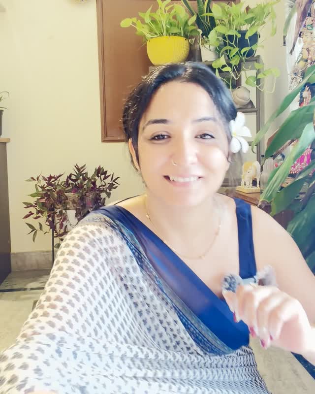 Neeru smiling to camera during a live session